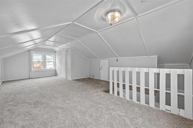 additional living space with lofted ceiling and carpet floors