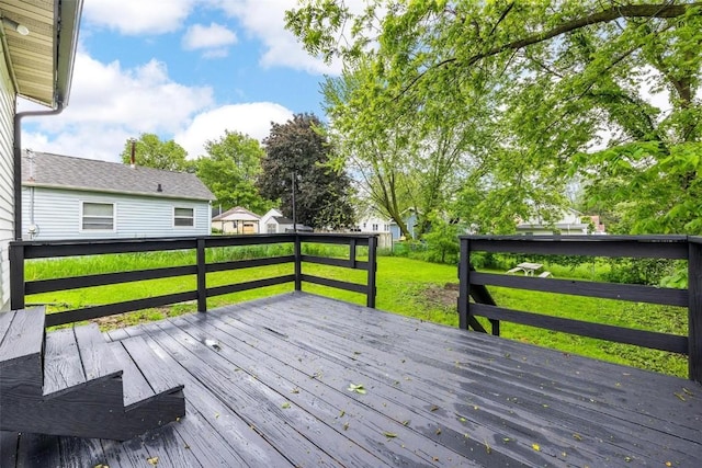 wooden deck with a yard