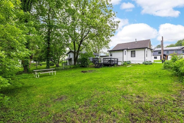 view of yard with a wooden deck