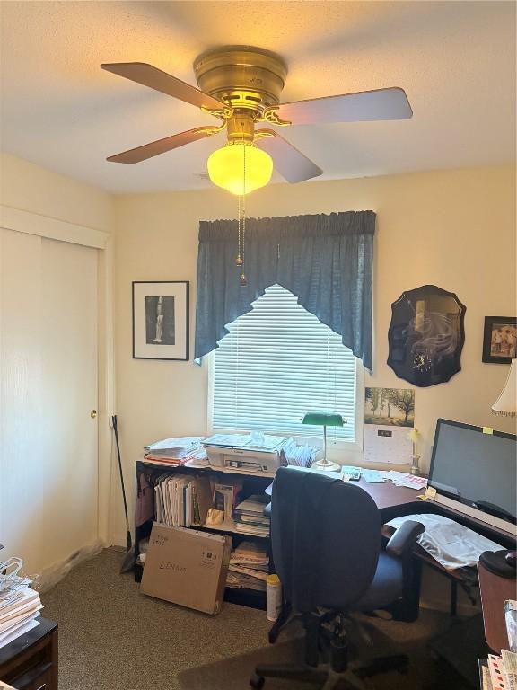 home office featuring carpet floors and ceiling fan