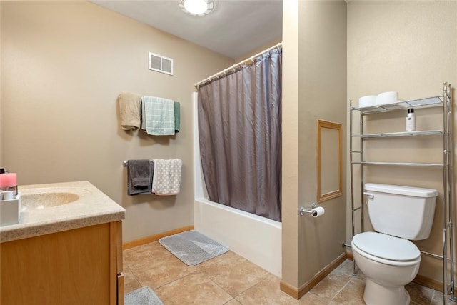 full bathroom with vanity, shower / tub combo with curtain, tile patterned floors, and toilet