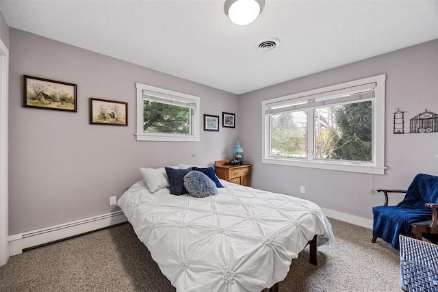 bedroom with a baseboard heating unit