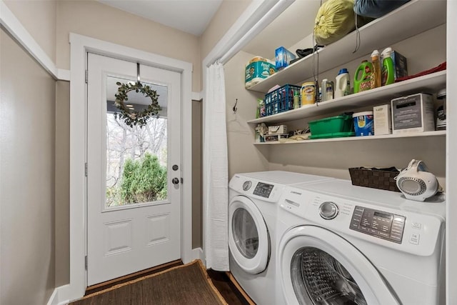 laundry area with washing machine and dryer and dark hardwood / wood-style flooring