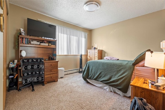 bedroom with light colored carpet, a textured ceiling, and baseboard heating