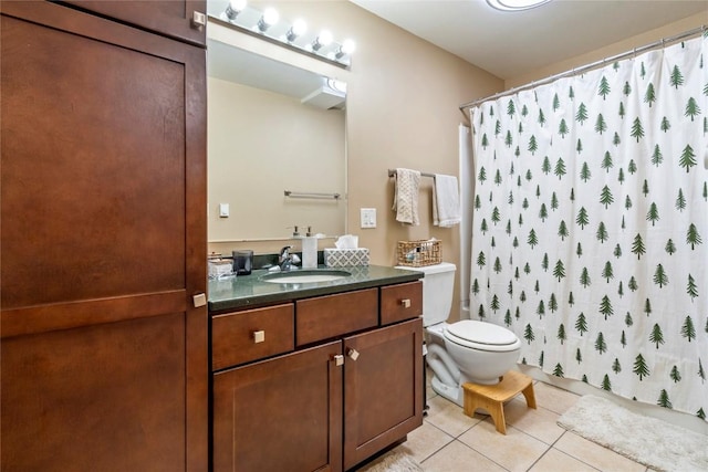 bathroom with tile patterned flooring, vanity, a shower with shower curtain, and toilet