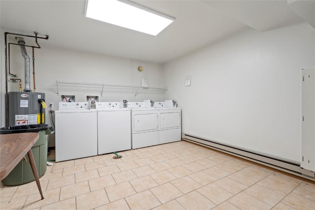 washroom with washing machine and dryer and a baseboard radiator