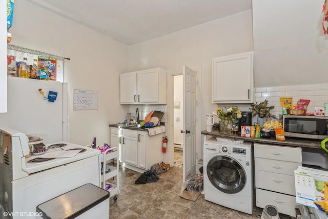 washroom featuring washer / dryer and sink