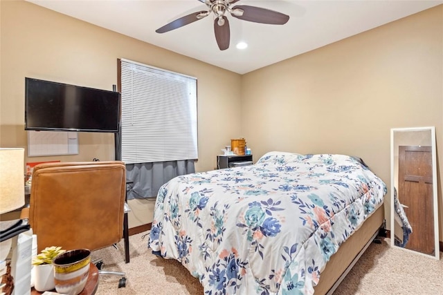 carpeted bedroom featuring ceiling fan