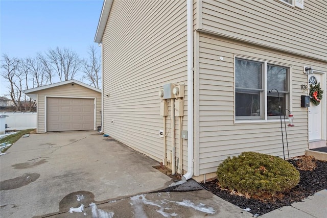 view of property exterior with a garage and an outdoor structure