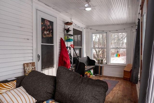 sunroom / solarium featuring ceiling fan and wooden ceiling