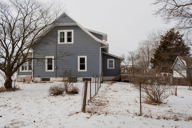 snow covered property featuring a deck