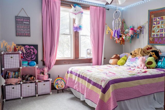 carpeted bedroom with ceiling fan