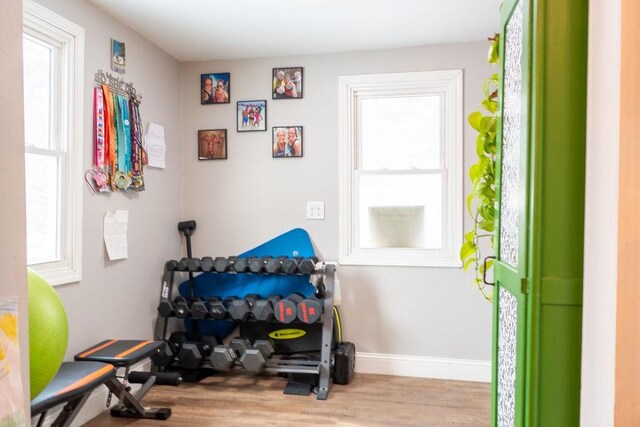 exercise area featuring light hardwood / wood-style flooring