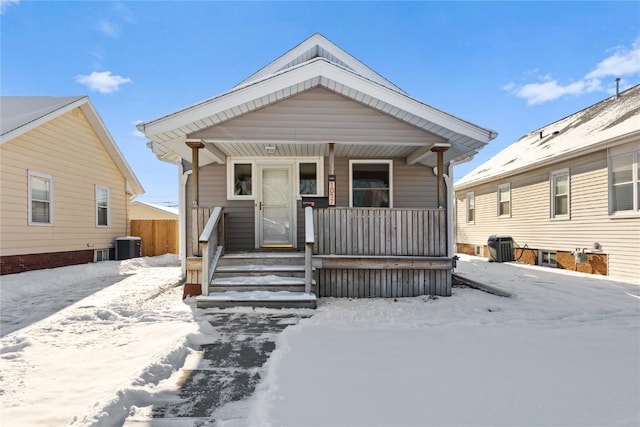 view of front of property with cooling unit and covered porch