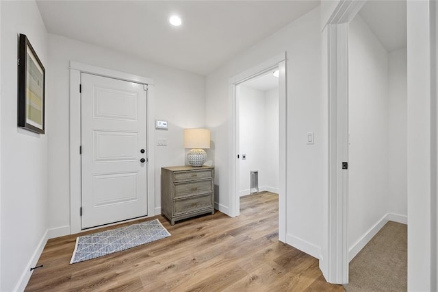 entryway with light hardwood / wood-style floors