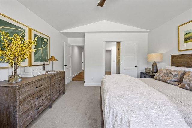 bedroom featuring light colored carpet, ceiling fan, and vaulted ceiling