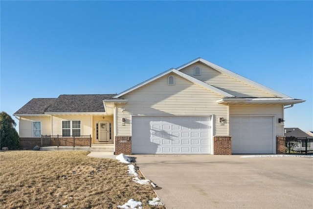 view of front of house with a garage and covered porch