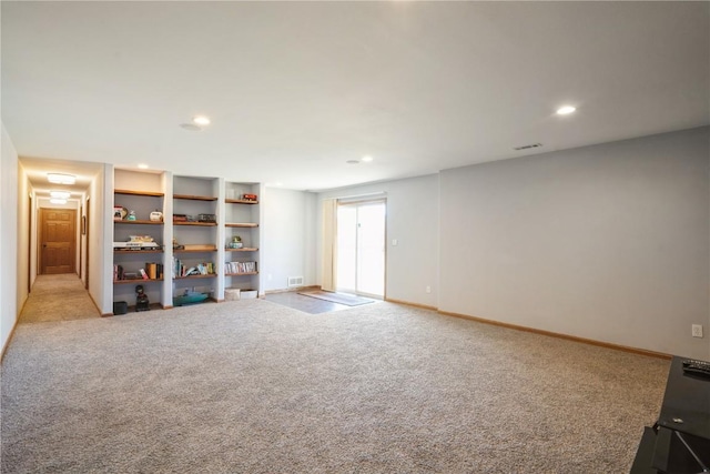 unfurnished living room featuring light carpet