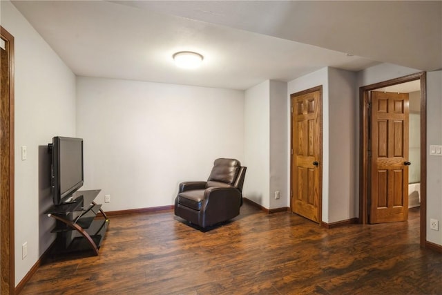 living area with dark hardwood / wood-style floors