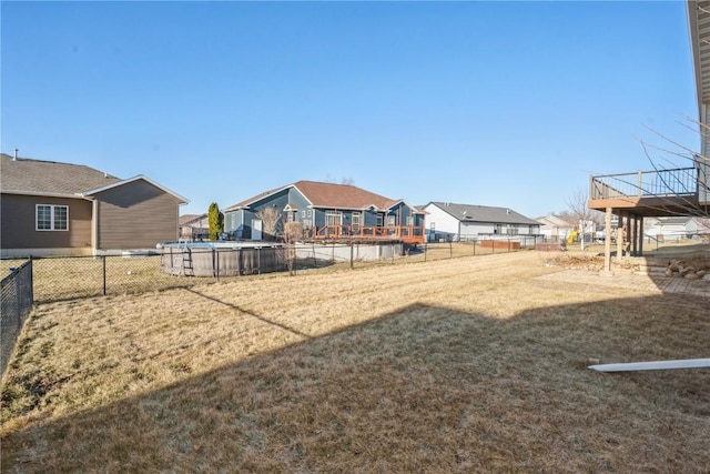 view of yard with a fenced in pool