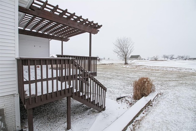 snow covered deck with a pergola