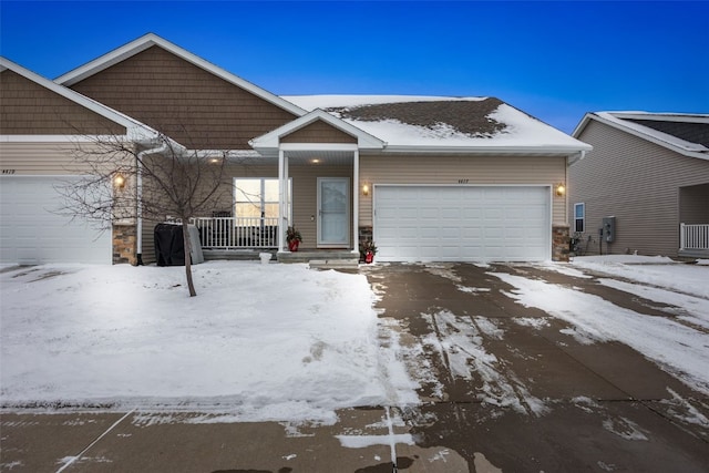 view of front of home featuring a garage and covered porch