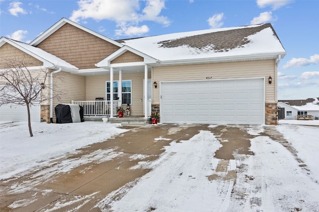 view of front facade featuring a garage and covered porch