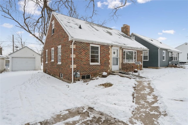 view of front of house with a garage and an outdoor structure