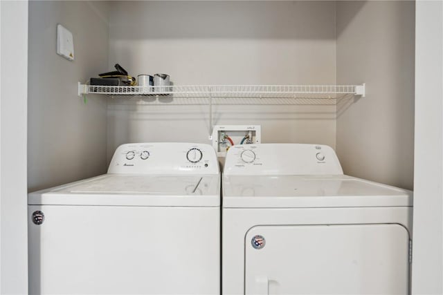 washroom with washer and dryer