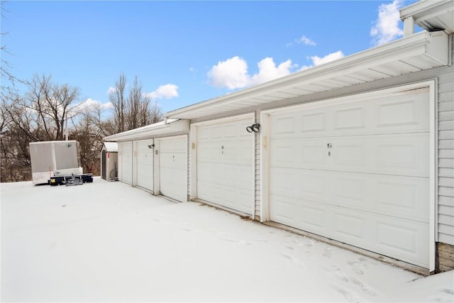 view of snow covered garage