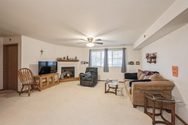 living room with ceiling fan and carpet floors