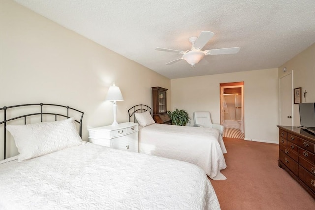 carpeted bedroom with ceiling fan and a textured ceiling