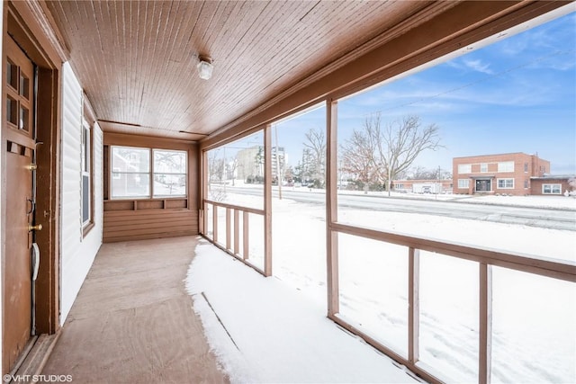 unfurnished sunroom featuring wooden ceiling