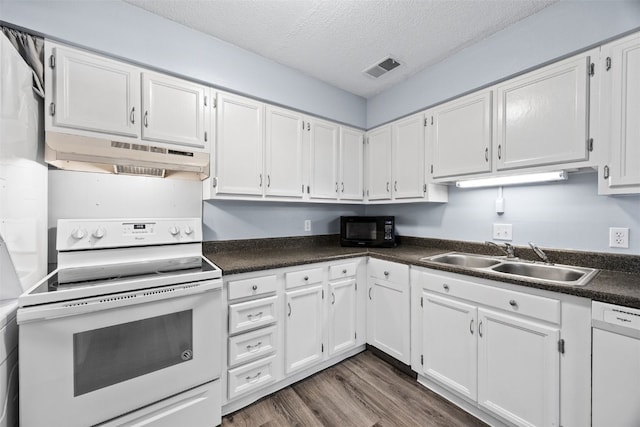 kitchen with white cabinetry, sink, and white appliances