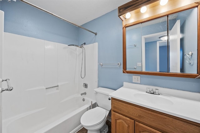 full bathroom featuring vanity, bathing tub / shower combination, and toilet