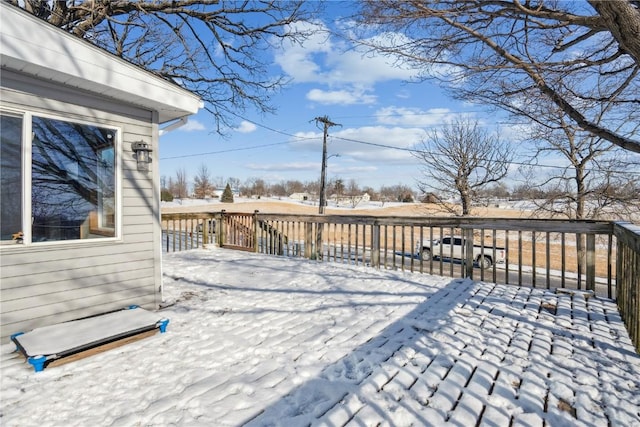 view of snow covered deck