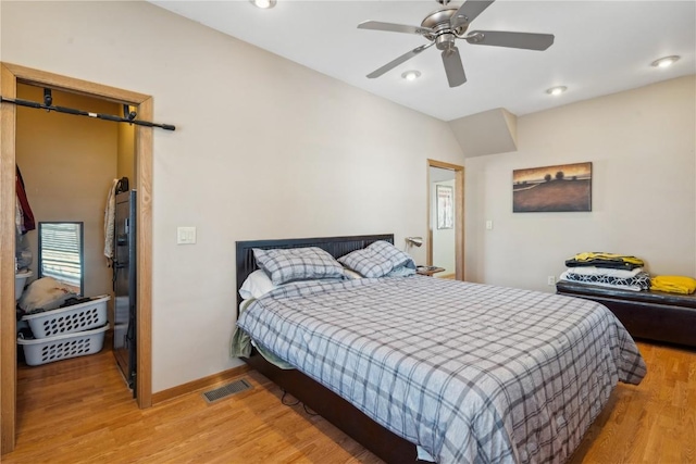 bedroom with ceiling fan and hardwood / wood-style floors