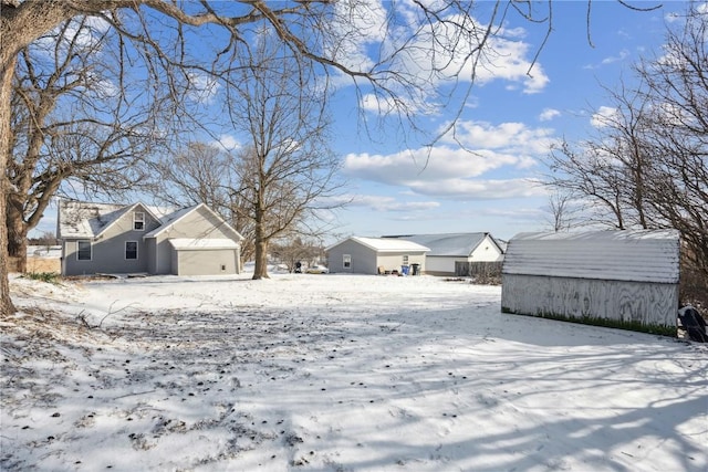 view of yard layered in snow