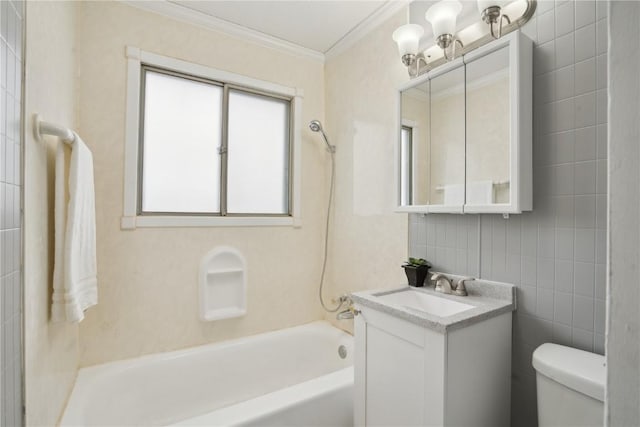 full bathroom with  shower combination, tile walls, vanity, ornamental molding, and toilet