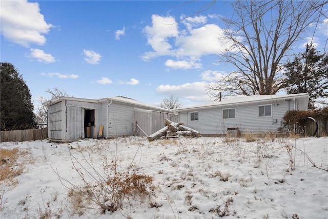 view of snow covered house