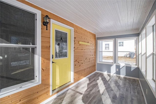 sunroom featuring wood ceiling