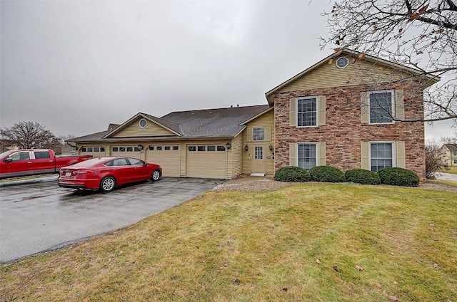 view of front of property featuring a garage and a front yard