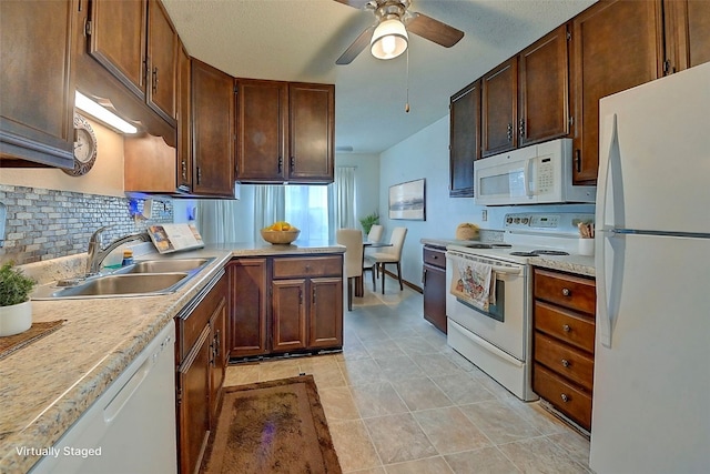 kitchen featuring tasteful backsplash, sink, white appliances, and ceiling fan