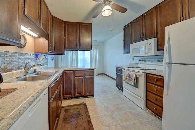 kitchen featuring tasteful backsplash, ceiling fan, sink, and white appliances