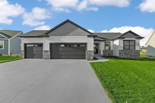 view of front of home with a garage and a front yard