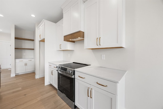 750 Hampshire Dr, Marion, IA 52302 - kitchen featuring electric range, light wood finished floors, white cabinetry, recessed lighting, and custom exhaust hood