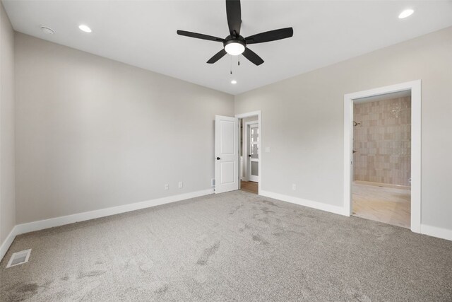750 Hampshire Dr, Marion, IA 52302 - unfurnished bedroom featuring carpet, recessed lighting, ensuite bathroom, and a ceiling fan