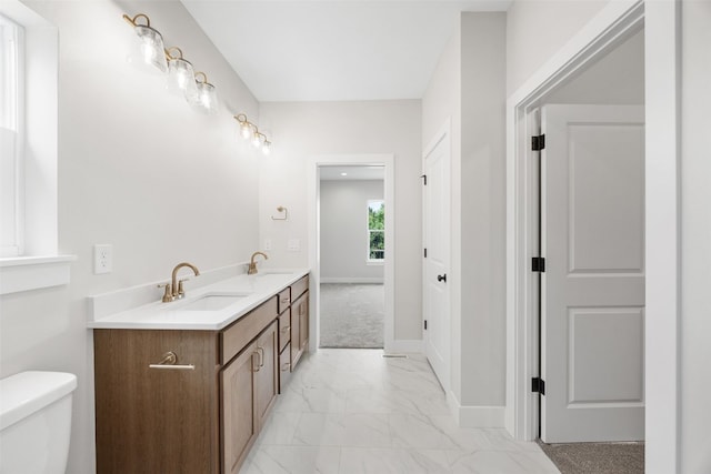 750 Hampshire Dr, Marion, IA 52302 - full bath featuring marble look tile flooring and double vanity