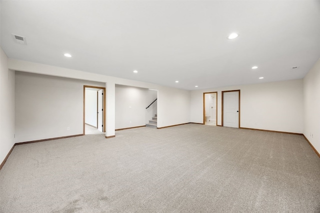 750 Hampshire Dr, Marion, IA 52302 - spare room with recessed lighting, stairway, and light carpet