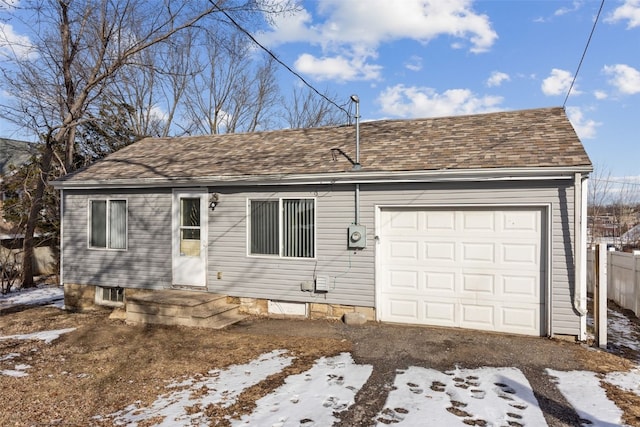 ranch-style house featuring a garage